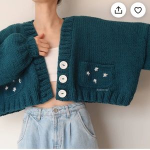 Hand knit cropped cardigan with flower pockets
